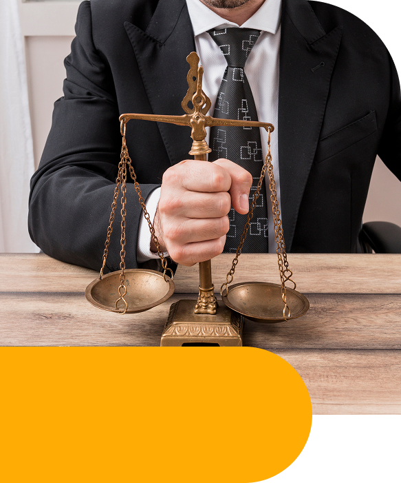 nomik legal home page image of justice scale at a desk